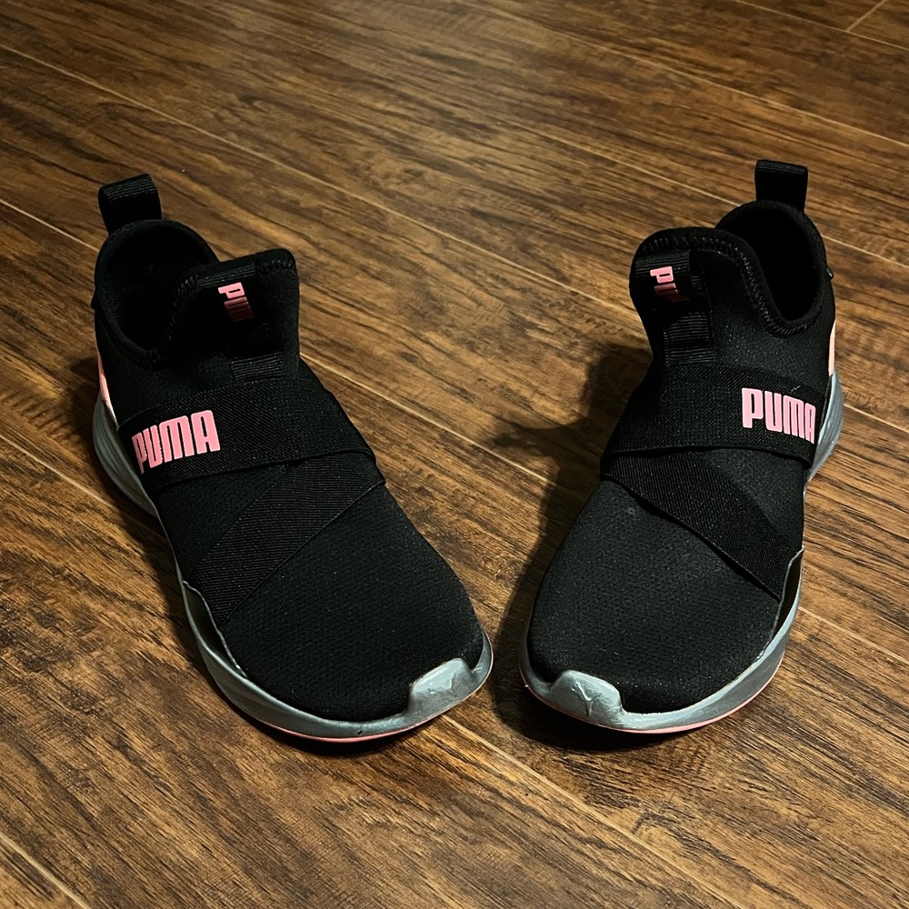 Black and pink Puma sneakers